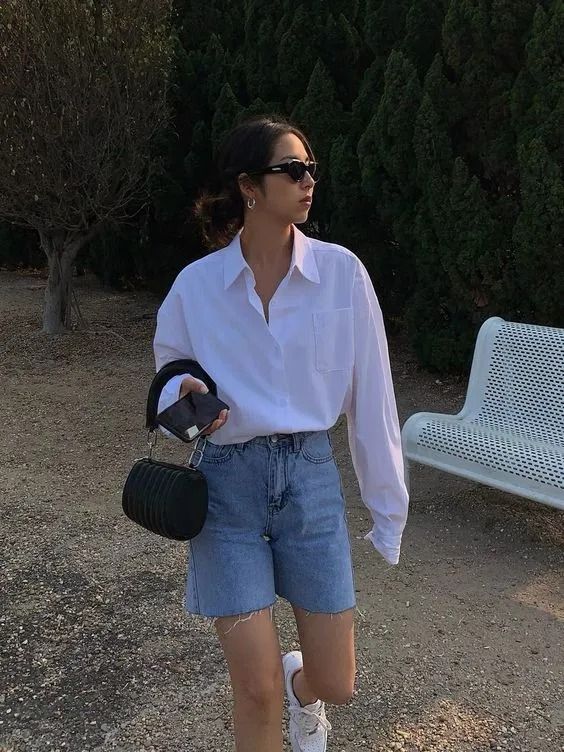 Bermudas styled with an oversized white shirt