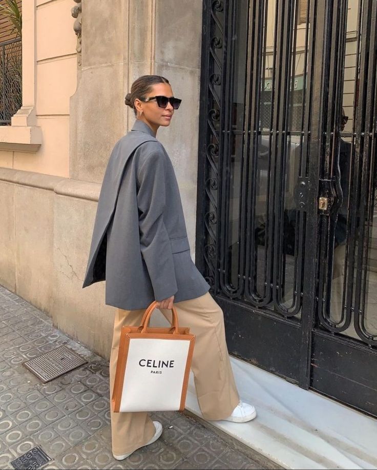 girl dressed in padded grey blazer